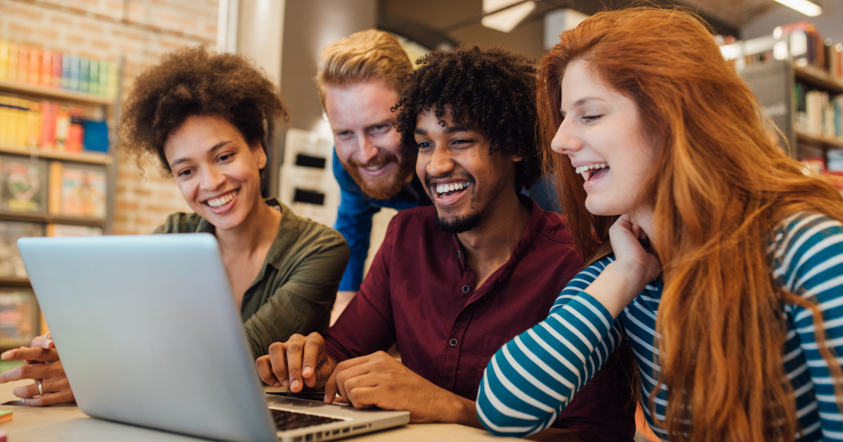 A group of students working on a laptop 