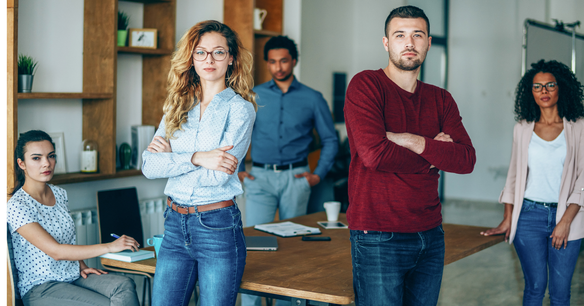 A group of students standing confidently